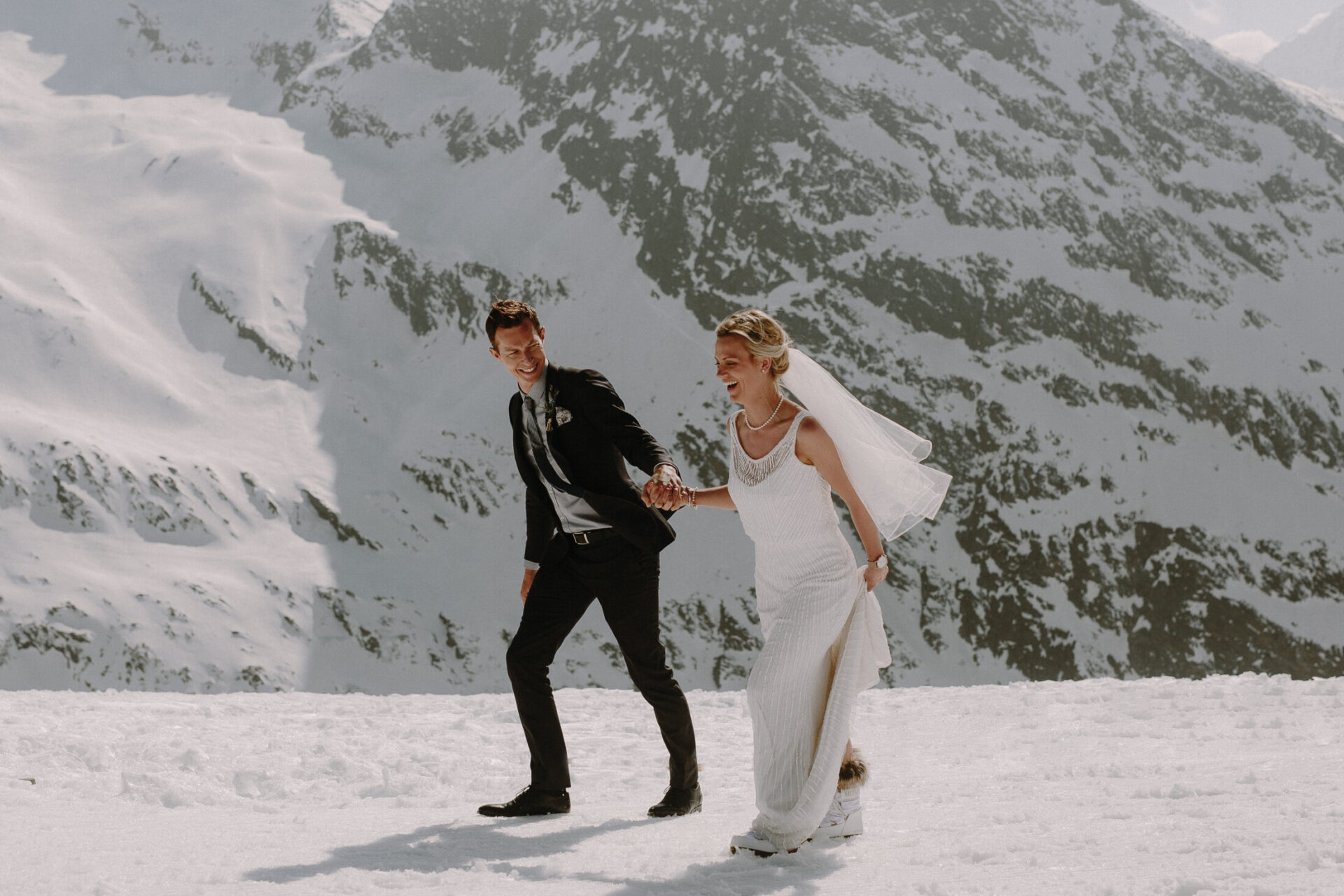 married couple walking on a mountain