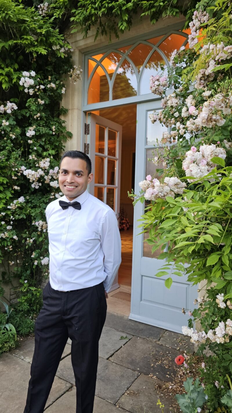 private house staff waiter outside a luxury house in the cotswolds
